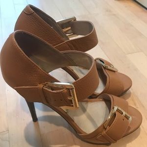 Tan heels with gold buckle accents